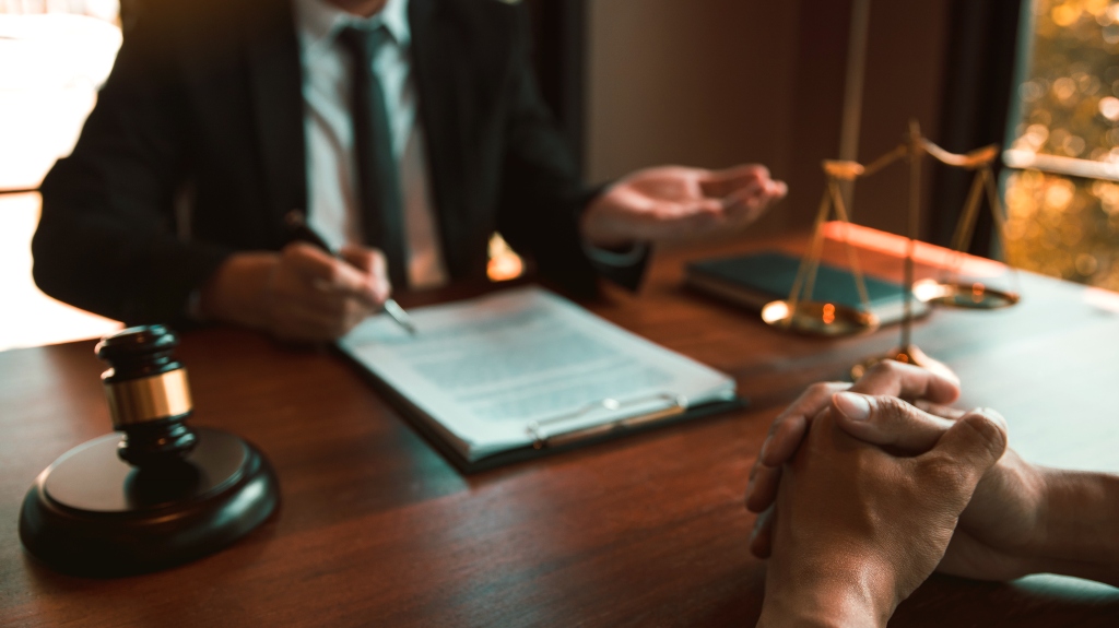 Lawyer is providing information about the client's trial at the lawyer office