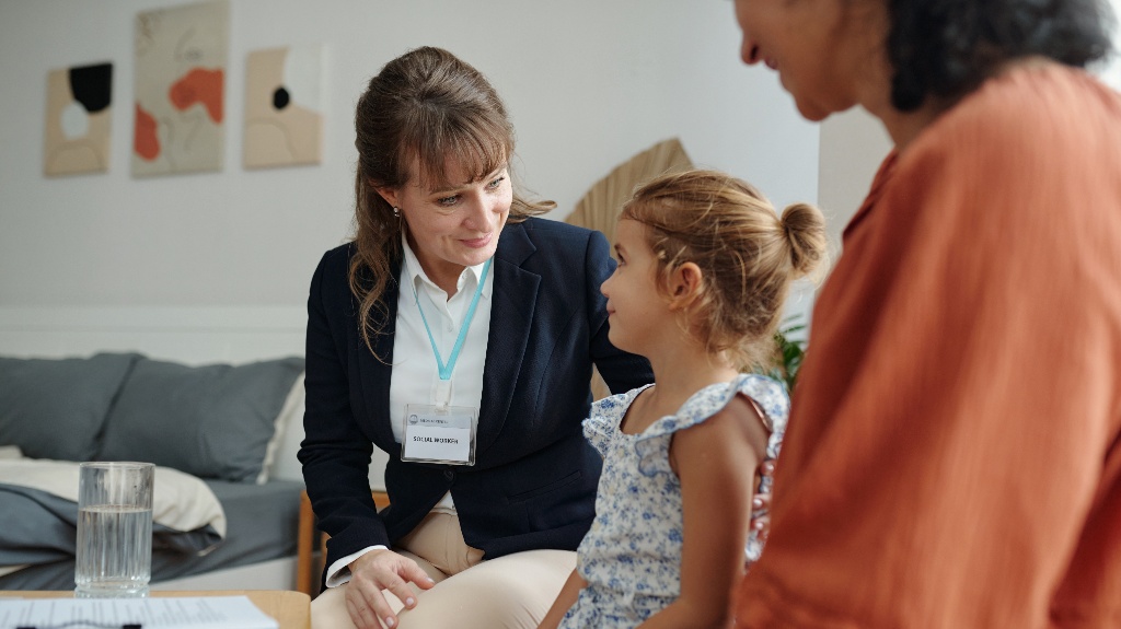 Social worker visits family at home